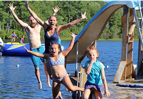 Cq campers jumping in the lake
