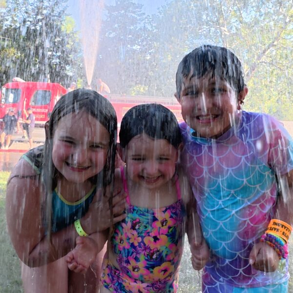 campers on the splash pad